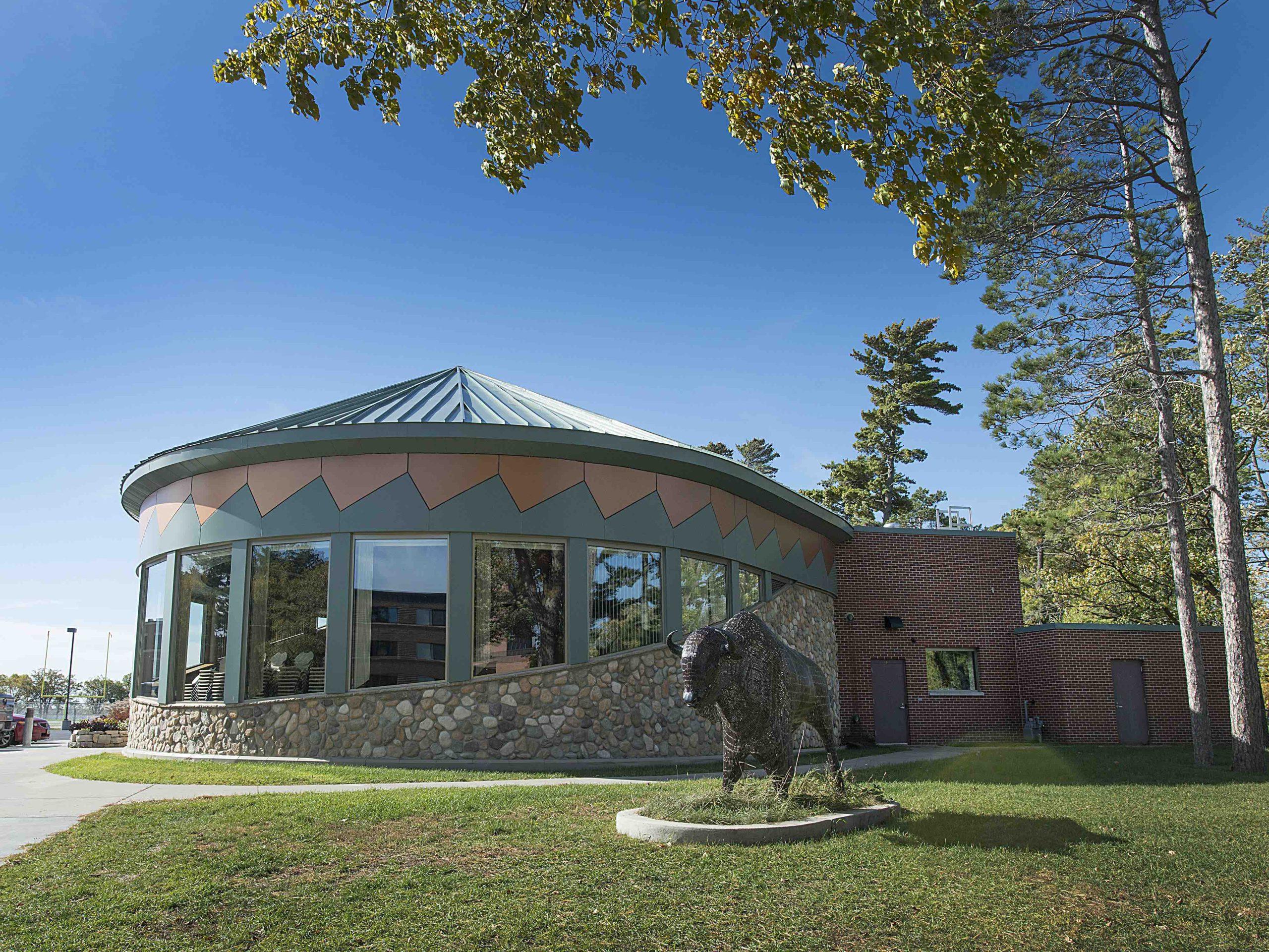 American Indian Resource Center with sculpture of bison in front